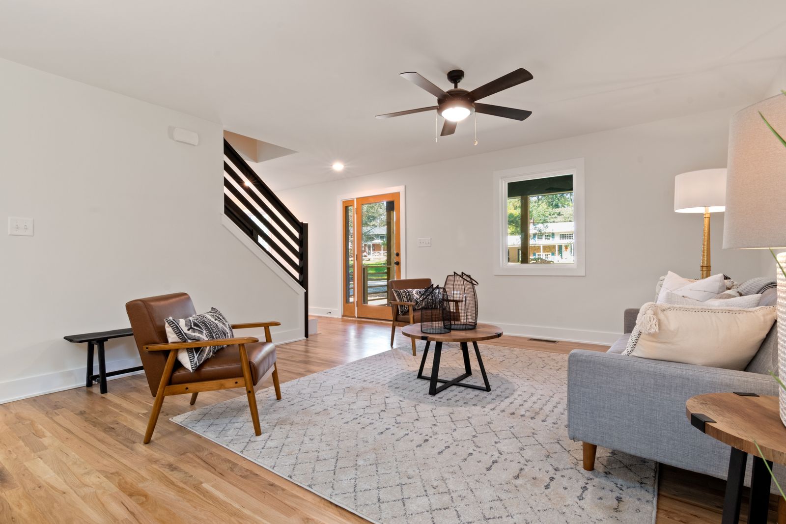 Living room interior in a renovated home, used to illustrate the scope of a $250,000 whole home remodel.